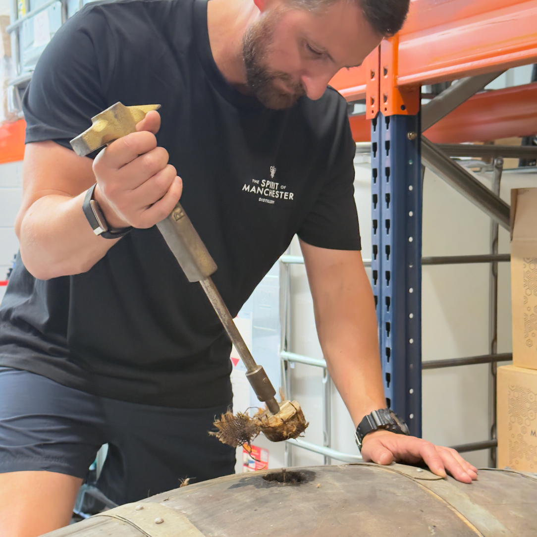 Seb Heeley checking Manchester Rum ageing barrels at The Spirit of Manchester Distillery