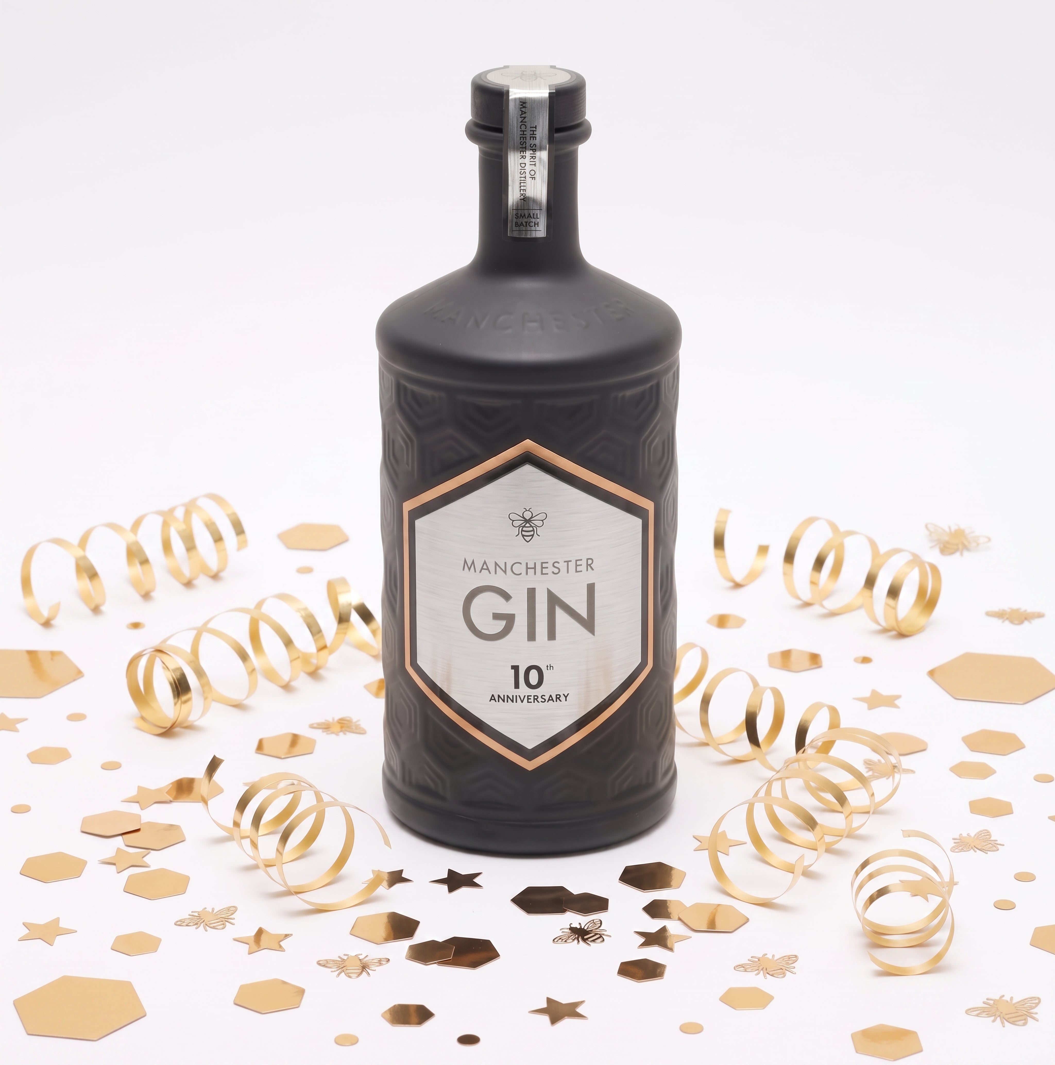 Manchester Gin 10th Anniversary Edition bottle with metallic anniversary label celebrating 10 years of distilling