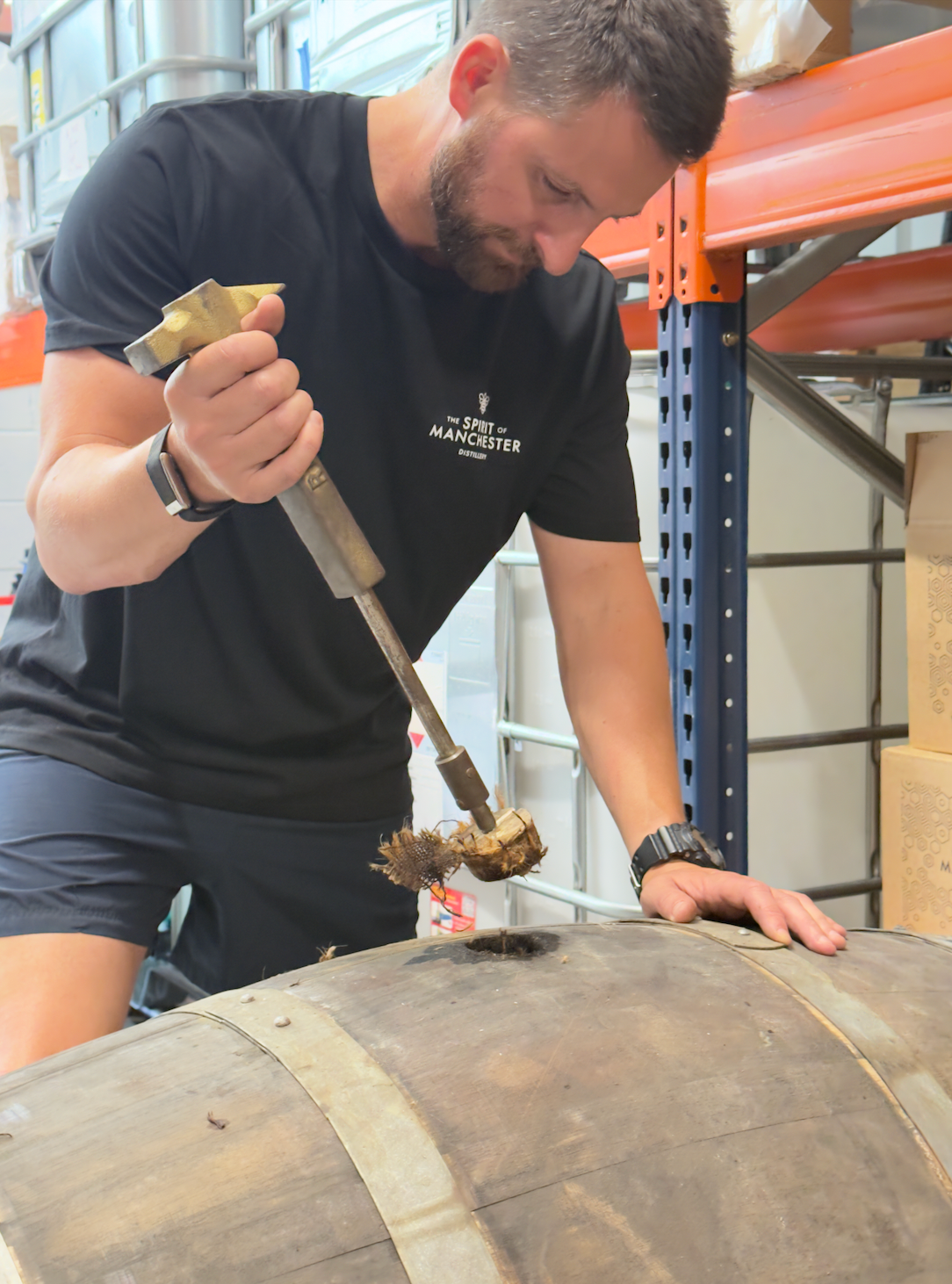Seb Heeley checking Manchester Rum ageing barrels at The Spirit of Manchester Distillery