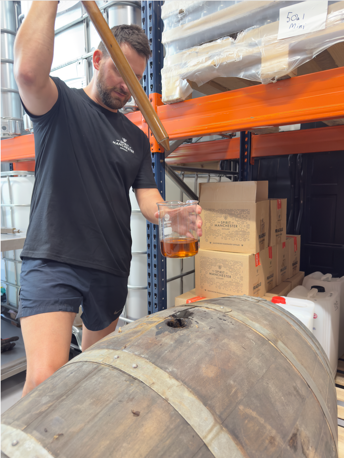 Seb Heeley checking Manchester Rum ageing barrels at The Spirit of Manchester Distillery